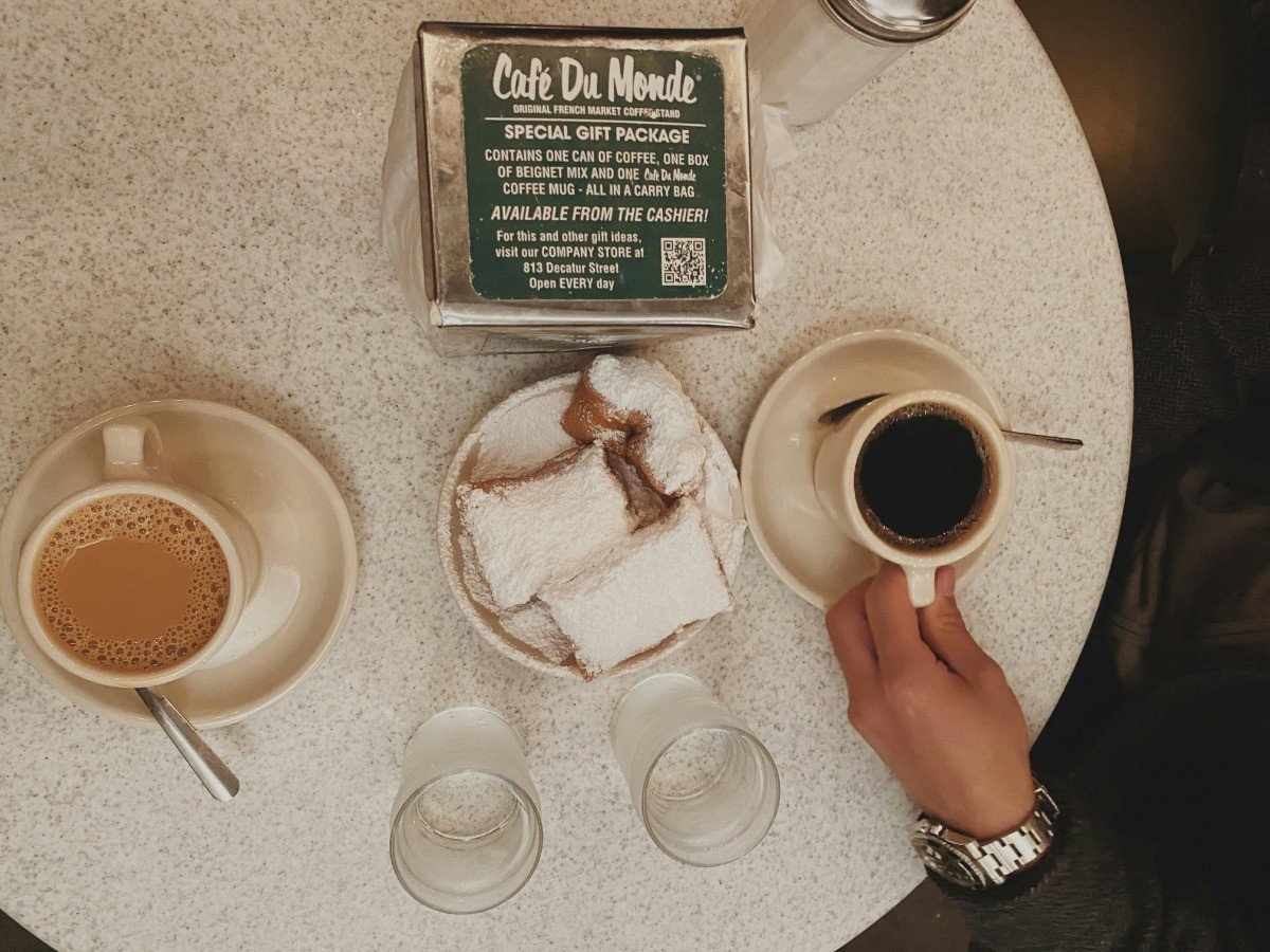 Table at Cafe Du Monde with Coffee and Beignets